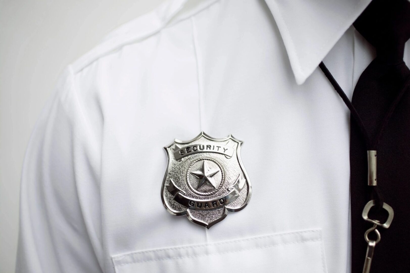 A close up of the badge on someone 's uniform.