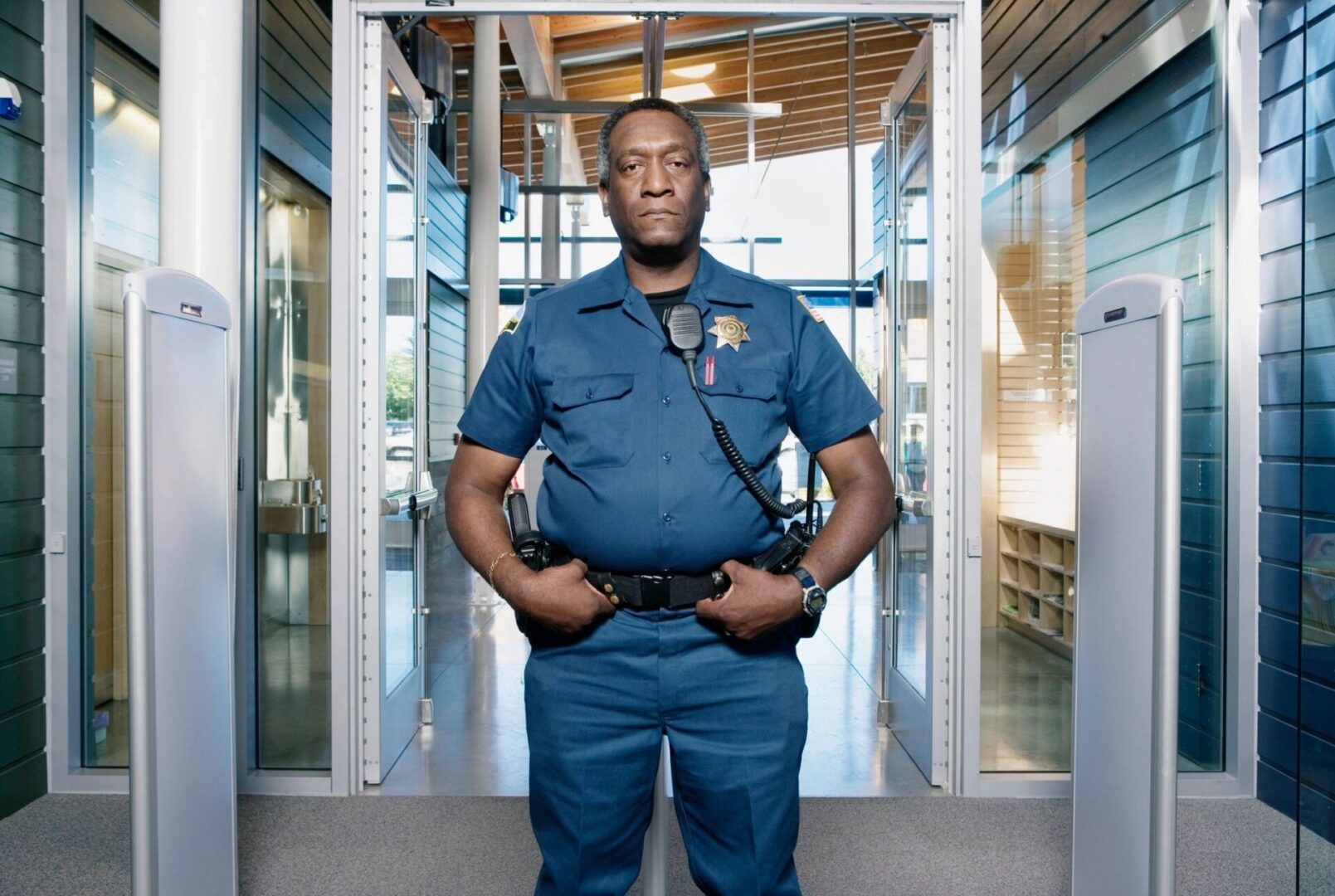 A police officer standing in front of a building.